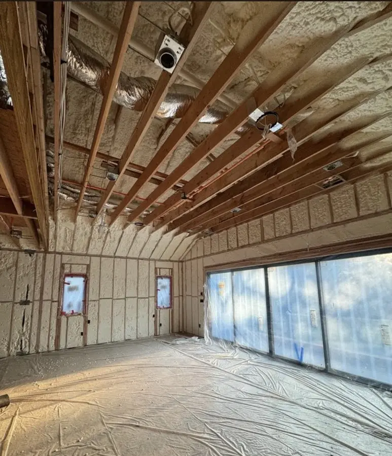Interior walls and ceiling insulated with spray foam during new construction in Universal City